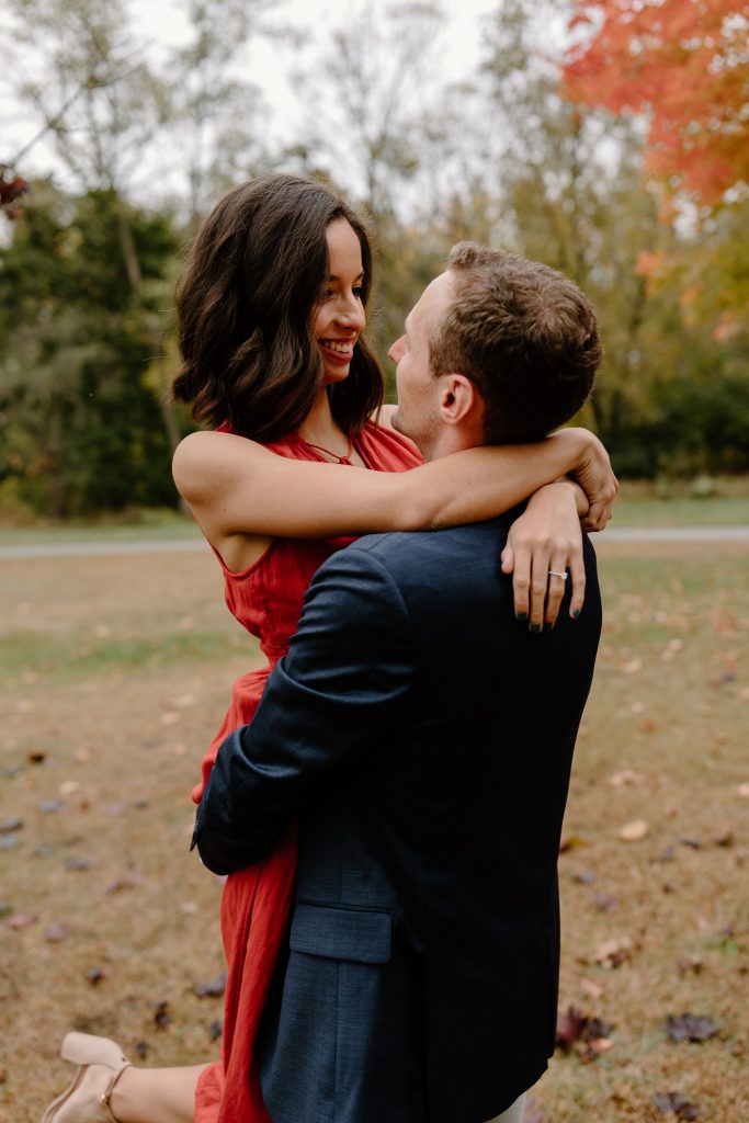 close up portrait of man and woman in red dress