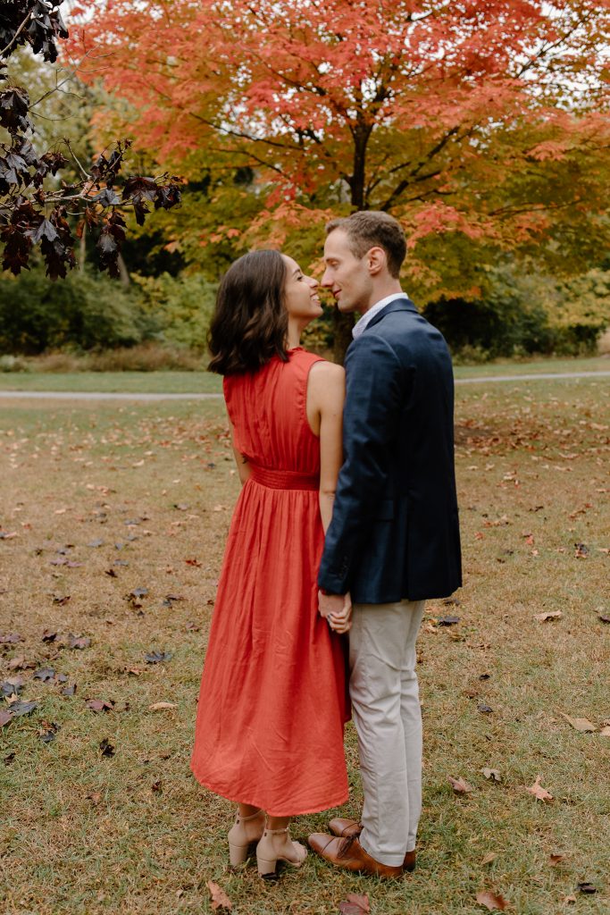 close up portrait of man and woman in red dress