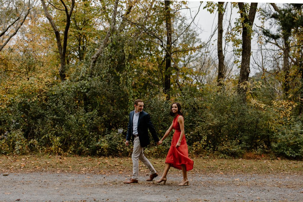 Picture of man leading a woman in a red dress