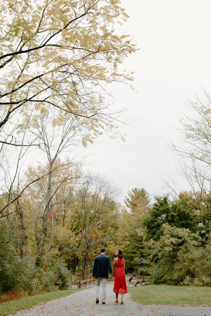 zoomed out picture of a man and woman walking