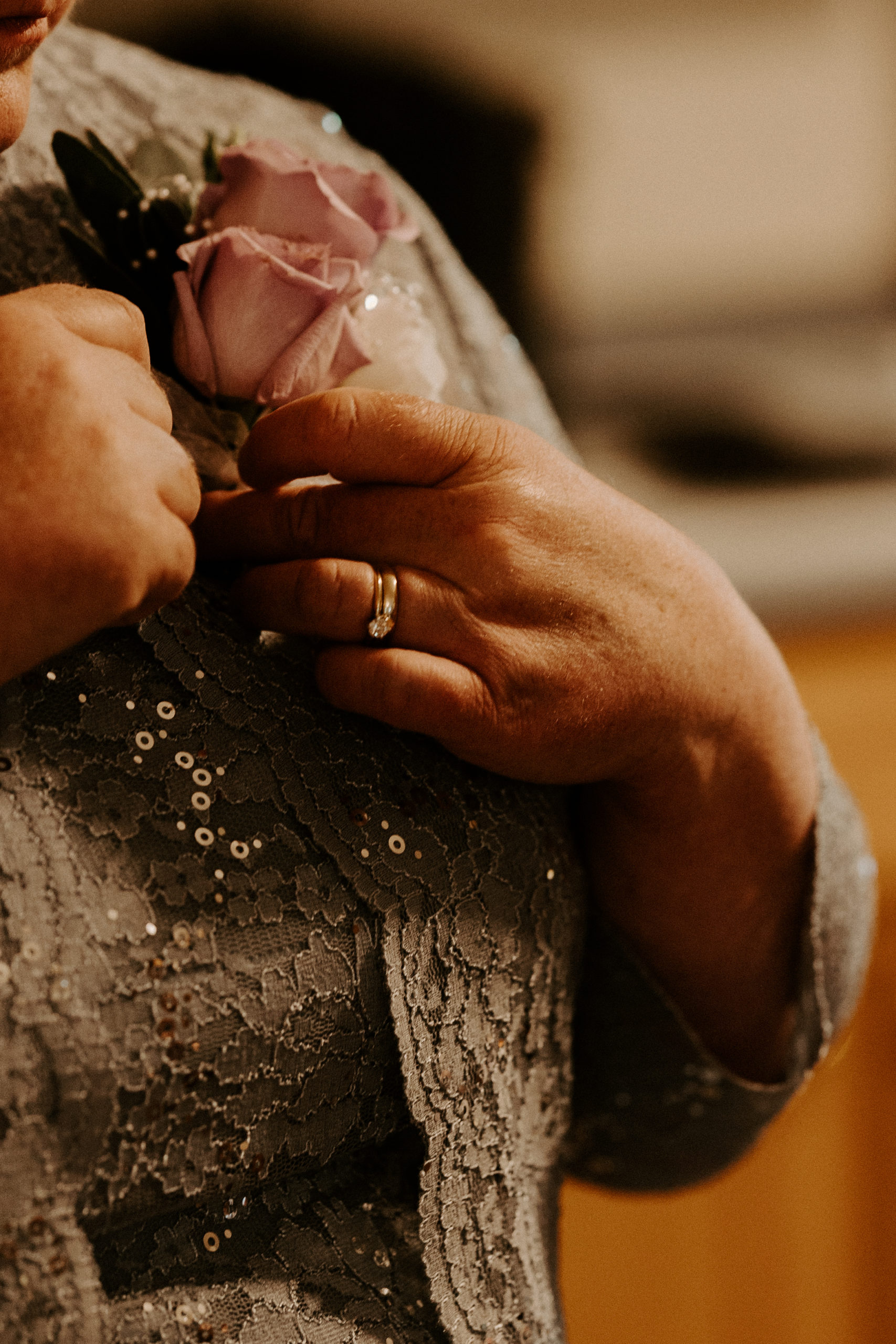 mother of the groom close up shot of hands