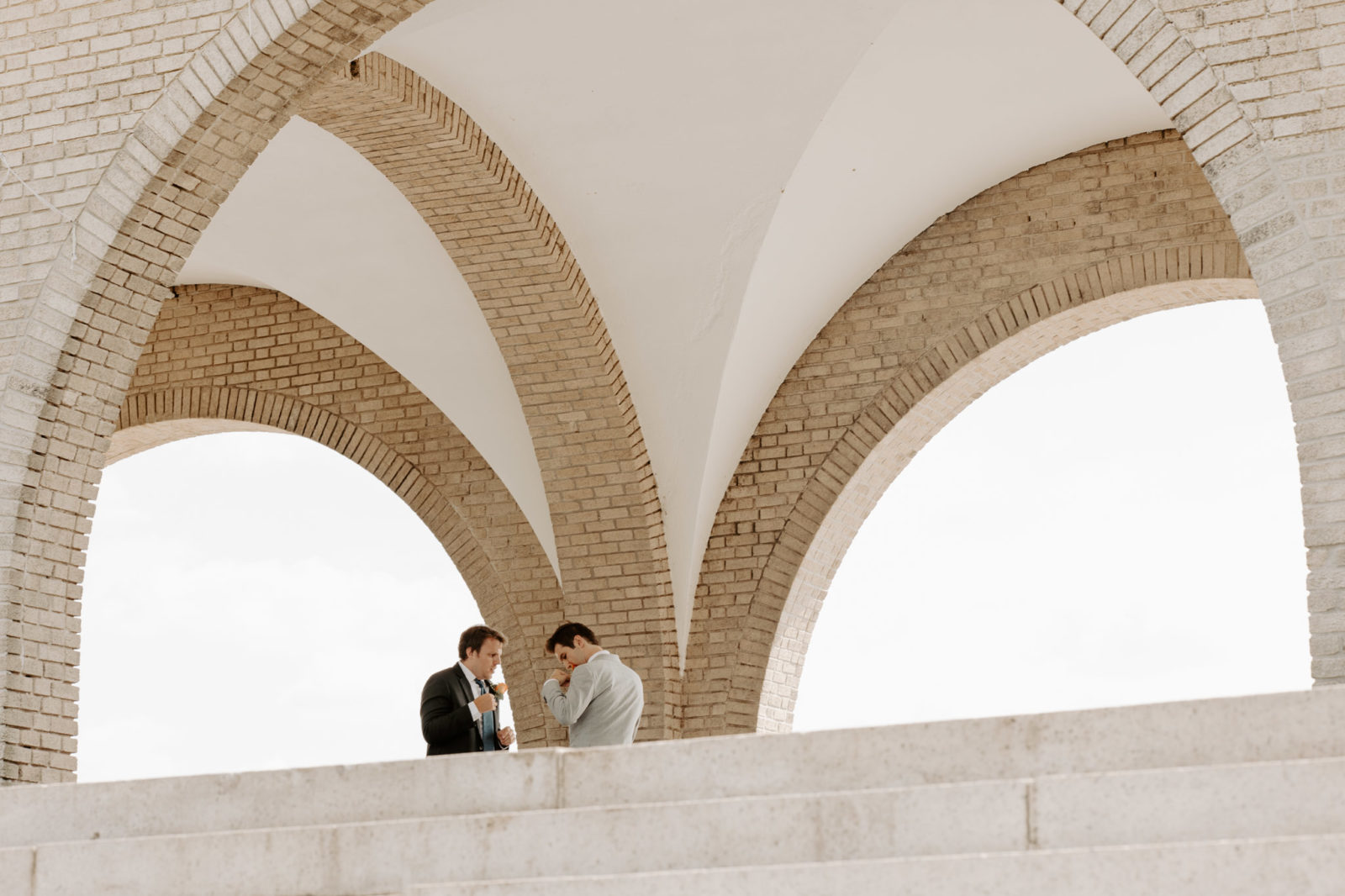 groomsmen prepping groom for first look