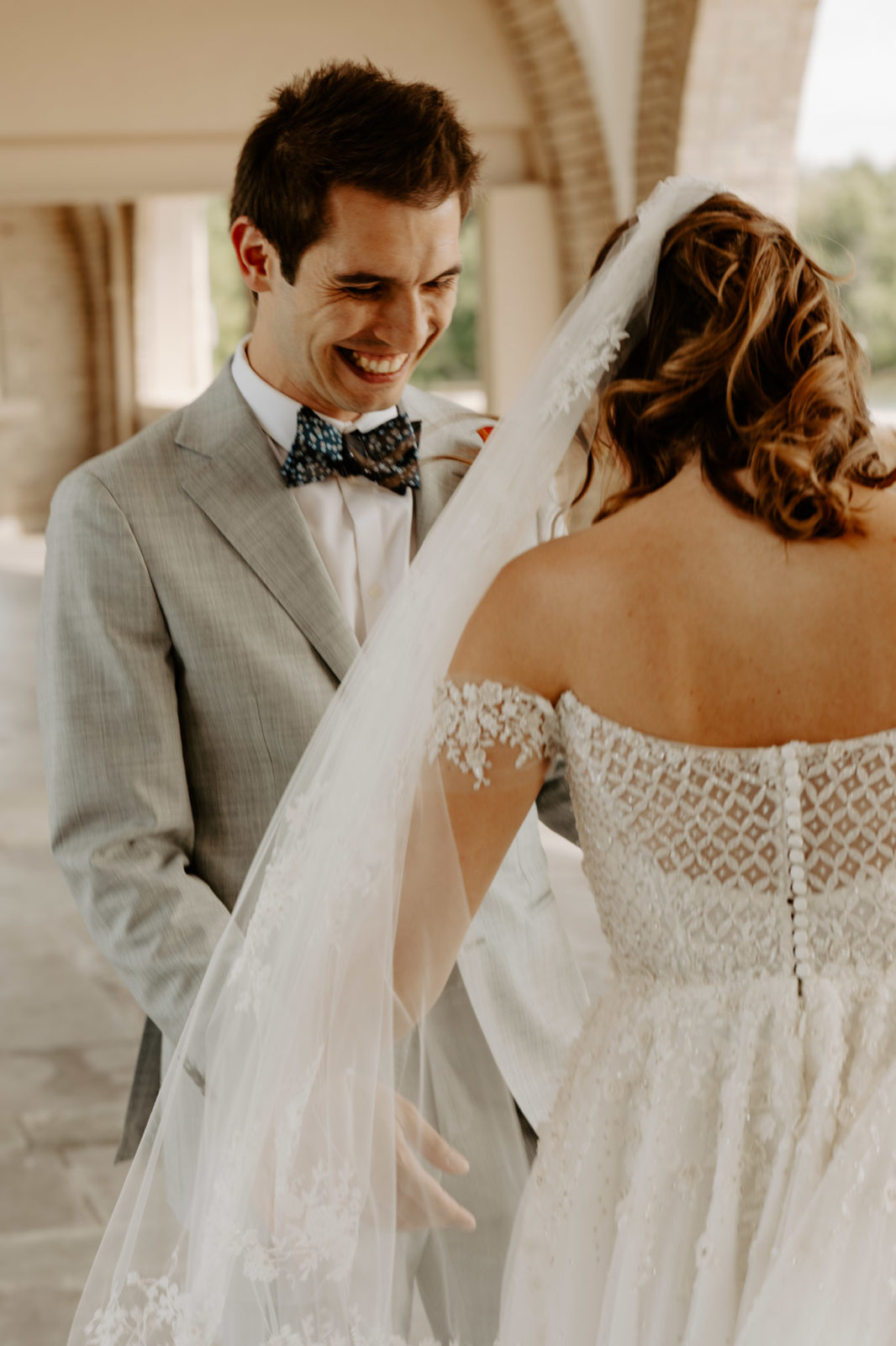 groom smiling at bride